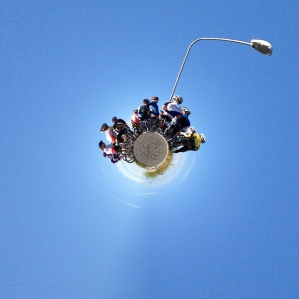 Tiny planet full of cyclers and a lonely streetlamp